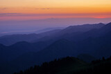 Silhouettes of mountain ranges in the morning haze