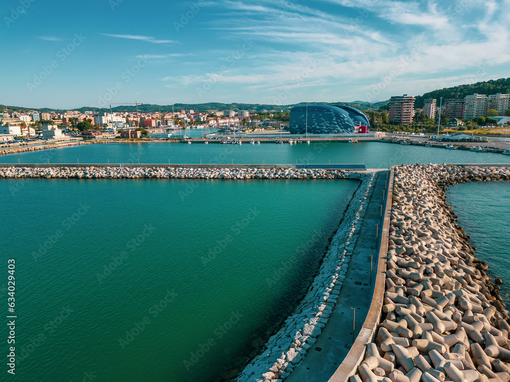 super panoramic aerial view outside the port of Pesaro where you can see the Levante and Ponente beaches, the port with the nautical center and the breakwater cliffs,the park mountain of San Bartolo