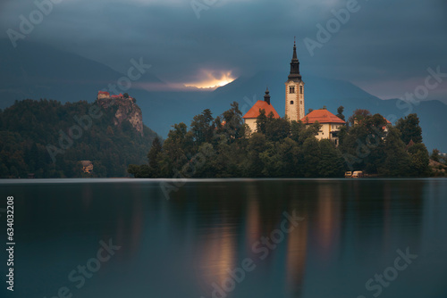 Amazing View On Bled Lake, Island,Church And Castle With Mountain Range (Stol, Vrtaca, Begunjscica)