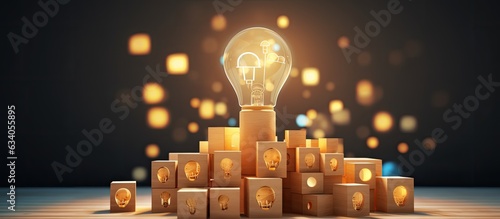 Concept of creative thinking and innovation for business growth represented by wooden cube blocks with light bulb and cycle icons on a clean background with spa