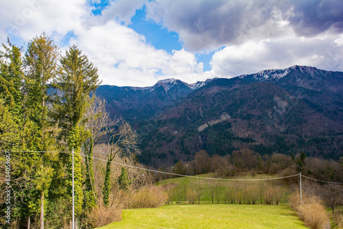 The early spring alpine landscape around the village of Mione in Carnia, Udine Province, Friuli-Venezia Giulia, north east Italy photo