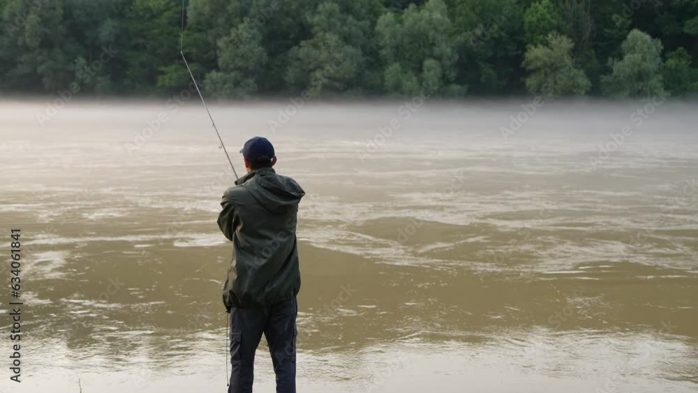 Man fishing on the mountain river. Slow motion Man fishing on the mountain river. Slow motion