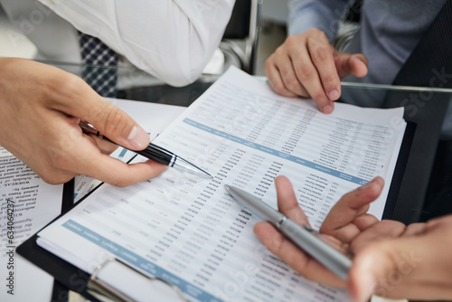 two businessmen watching a growth chart close-up