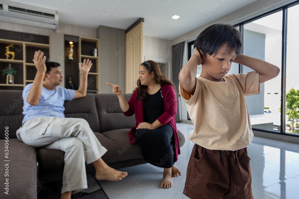 Asian family with domestic violence while parent having verbal abuse and fighting, screaming before their kid for toxic relationship, unhappy couple and trouble alcoholic people Asian family with domestic violence while parent having verbal abuse and fighting, screaming before their kid for toxic relationship, unhappy couple and trouble alcoholic people