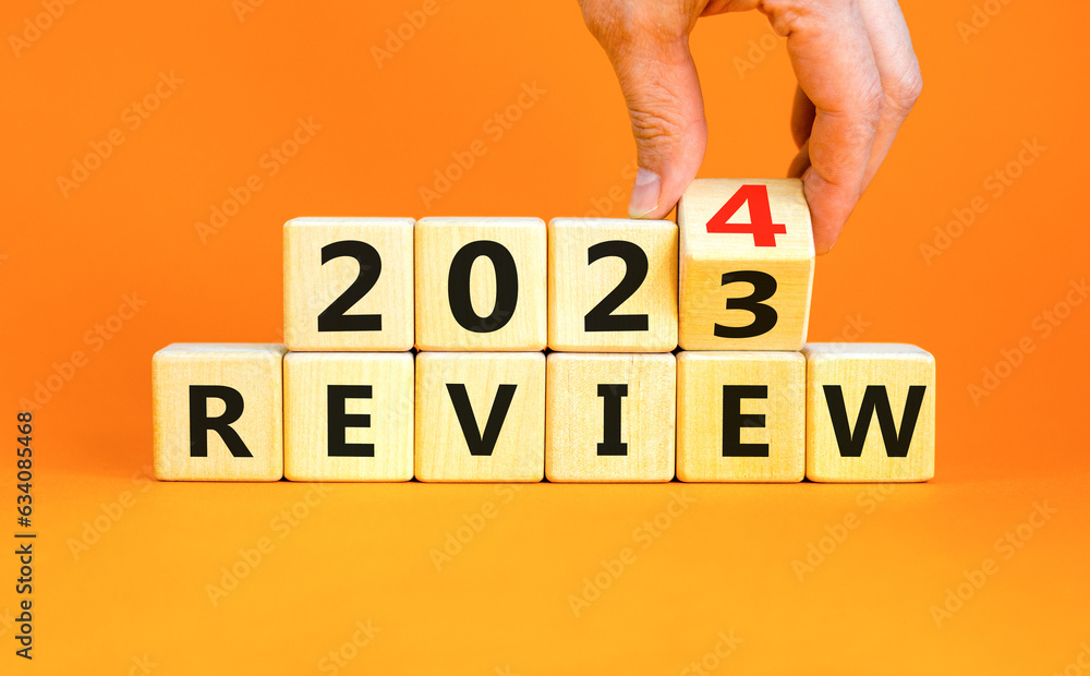 2024 Review New Year Symbol Businessman Turns A Wooden Cube And Changes Words Review 2023 To 2024 Review New Year Symbol Businessman Turns A Wooden Cube And Changes Words Review 2023 To