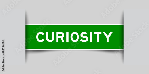 Green color square label sticker with word curiosity that inserted in gray background