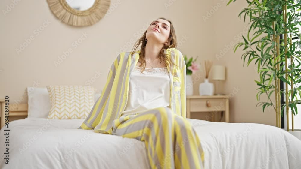 Young blonde woman lying on bed at bedroom Young blonde woman lying on bed at bedroom