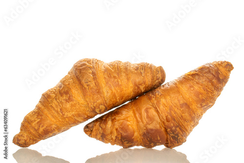 Two fragrant croissants with chocolate filling  close-up  isolated on white.