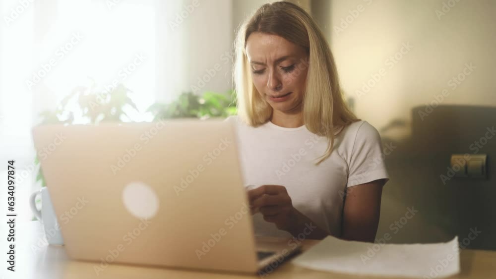 Sad crying woman talk with psychotherapist at online distance remote counselling session while got solution of problem indoors Depressed girl with psychological support by laptop computer at home Sad crying woman talk with psychotherapist at online distance remote counselling session while got solution of problem indoors Depressed girl with psychological support by laptop computer at home