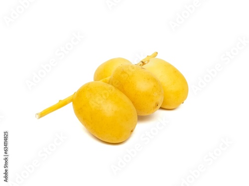 Fresh date palm yellow chemical free placed on a white background.