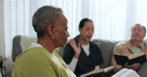 Senior black woman, bible and group in home, worship and prayer together. Elderly people, religion and study, spiritual praise and reading in knowledge, guide and community faith in retirement house photo
