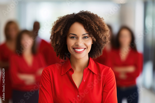 group of people standing in office, confident black woman wearing red leading corporate team with confidence 
