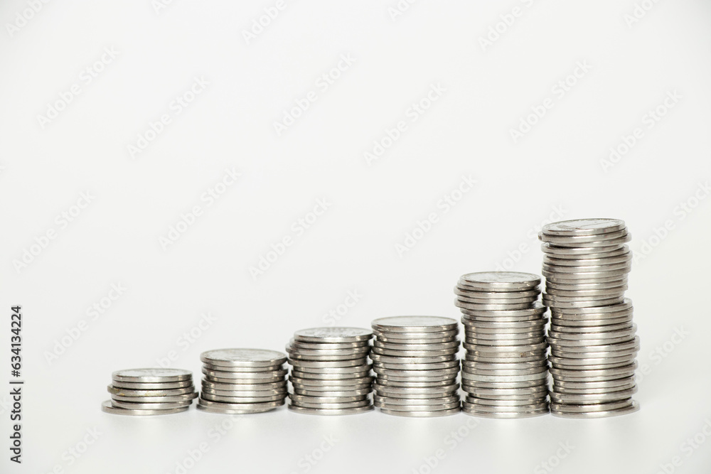 Stacks of coins stand on a white background, business Stacks of coins stand on a white background, business