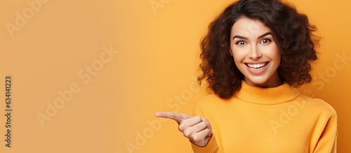 Happy young woman pointing to blank space content and attractive Space for your idea © HN Works