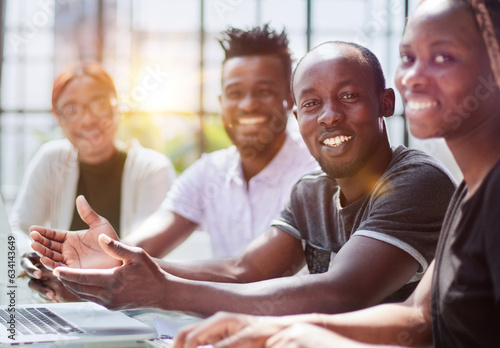 african businessman with group of businesspeople