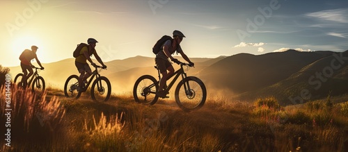 Three friends on electric bicycles enjoying a scenic ride through beautiful mountains photo