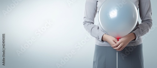 Relieving pain from a bloated stomach with a balloon and needle photo