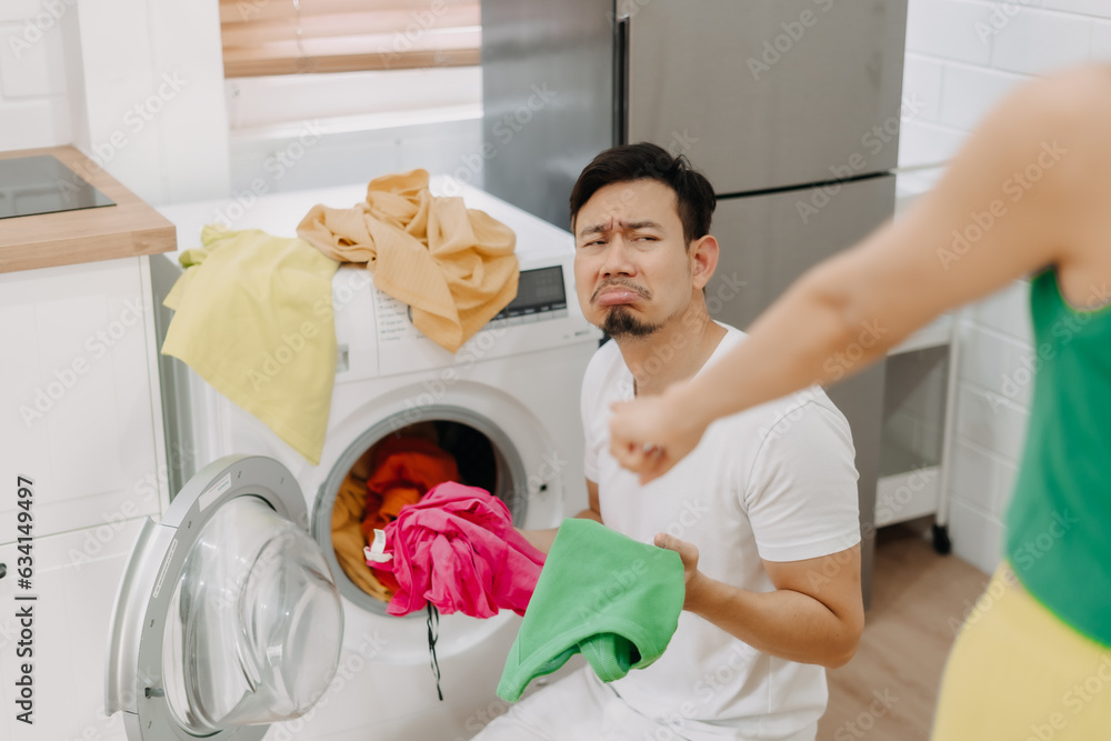 Funny crying face reaction of asian husband being forced to wash clothes by wife Funny crying face reaction of asian husband being forced to wash clothes by wife
