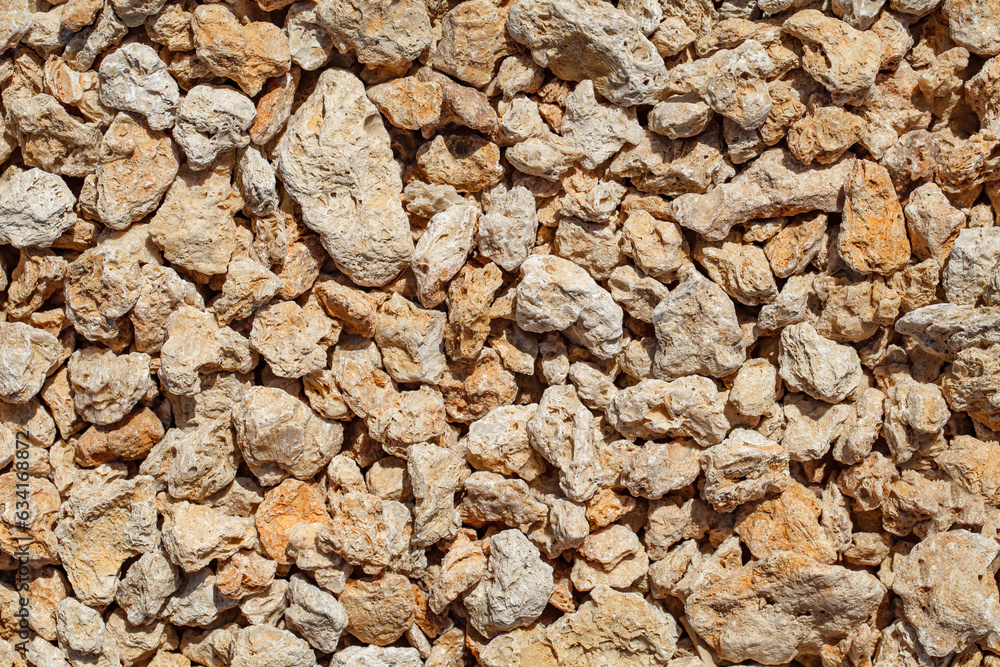 Stones small from sedimentary marine rocks close-up Stones small from sedimentary marine rocks close-up