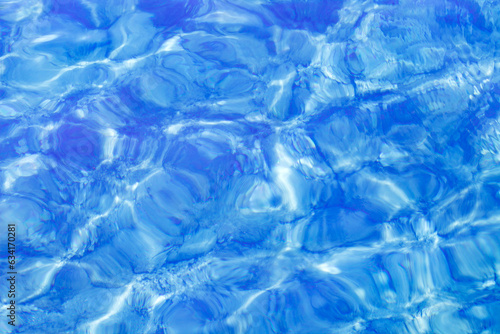 Clear sea water with excitement on surface, close-up, top view