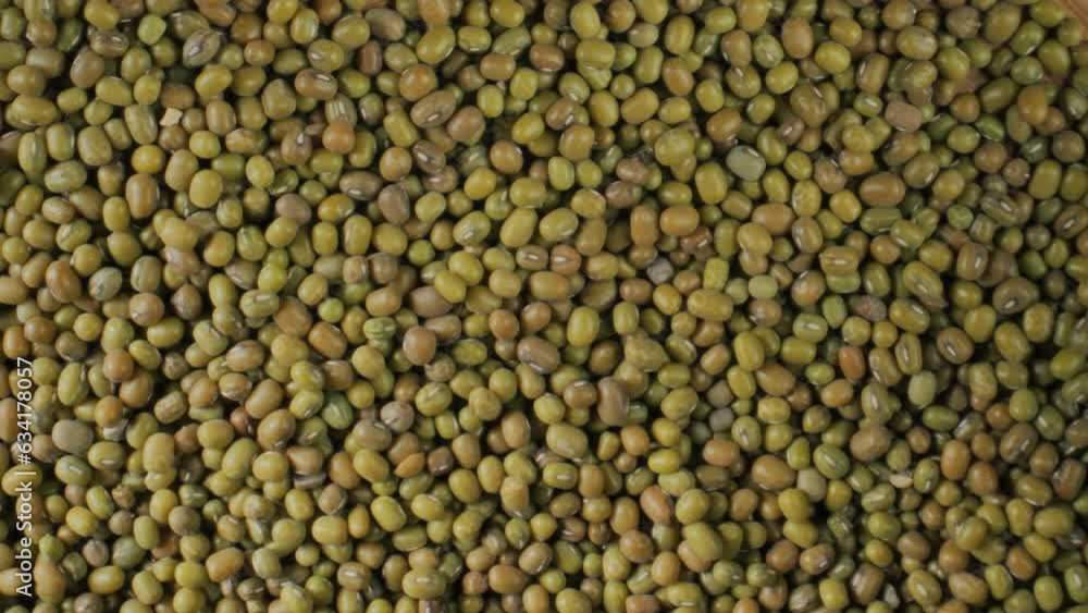 Green beans. Mung bean. Organic legumes Slow motion. Mung seeds. Groats. Turntable rotating shot. Green beans. Mung bean. Organic legumes Slow motion. Mung seeds. Groats. Turntable rotating shot.