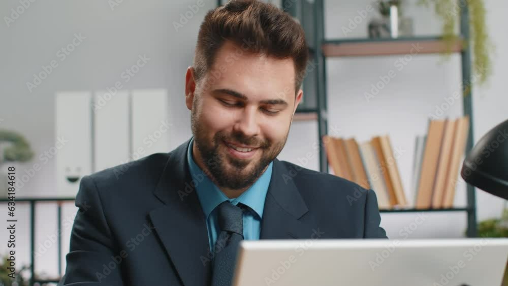 Close-up portrait Caucasian bearded businessman face freelancer at home office workplace working on laptop computer. Manager freelancer man works on notebook send messages makes online purchases Close-up portrait Caucasian bearded businessman face freelancer at home office workplace working on laptop computer. Manager freelancer man works on notebook send messages makes online purchases