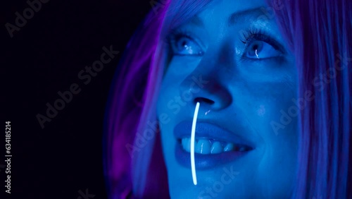 Astronaut in futuristic costume. Girl in glasses of virtual reality while touching air. Augmented reality game, future technology, AI concept. Dark background.