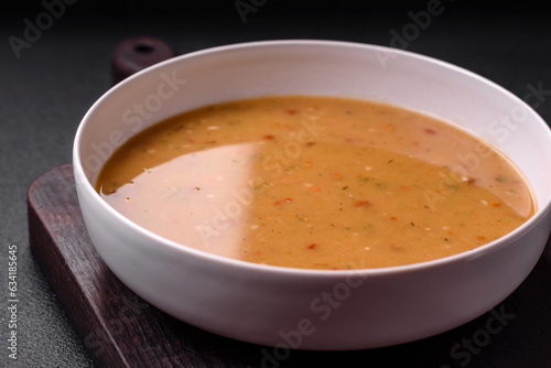 Delicious fresh vegetable soup with carrots, peppers, potatoes and onions