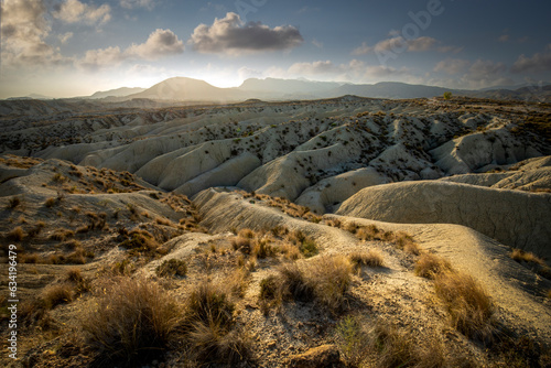 Fényképezés Arid landscape of Abanilla desert badlands, Murcia, Spain, at sunset