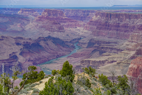Grand Canyon National Park, Arizona: The Colorado River flowing through the Canyon under a low cloud cover, seen from the Desert View area of the South Rim.