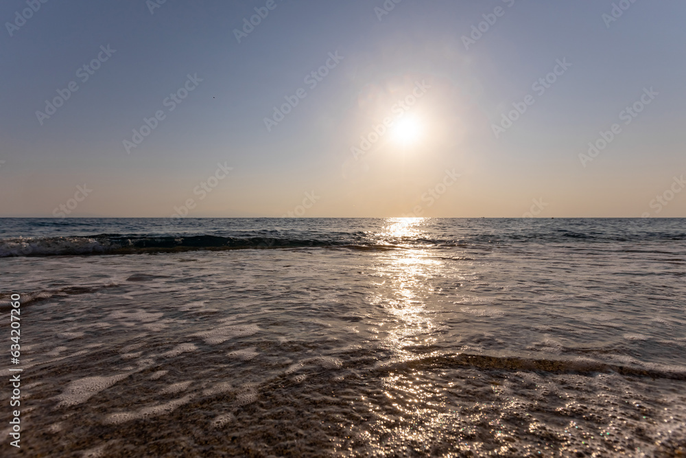 Naklejka premium a sunset on the sea beach