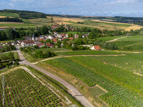 Aerial view on hilly vineyards and village Urville, champagne vineyards in Cote des Bar, Aube, south of Champange, France