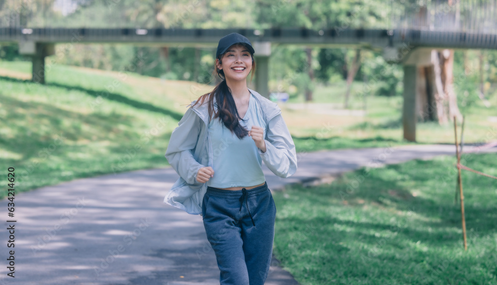 Fototapeta premium Stylish female runners in modern attire, discover serenity. Reenergize amid jogging the parkway.