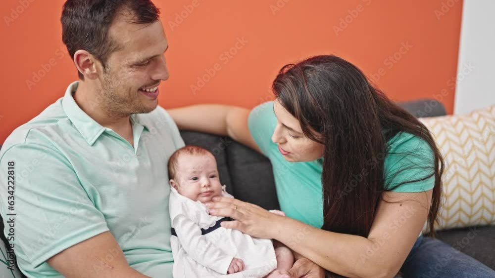 Family of three bonding sitting on the sofa at home Family of three bonding sitting on the sofa at home