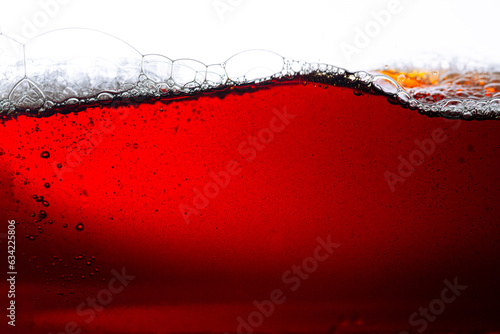 Macro cola drink isolated white background,Side view background of refreshing cola soda with air bubbles isolated on white.