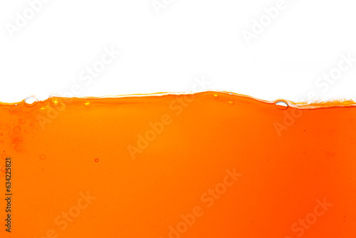 Macro orange juice texture isolated white background,Close-up Orange juice with bubbles on a white background.
