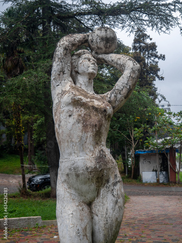 Old soviet abandoned sculpture. Abandoned monument. Victory Park. Soviet art. Corrosion on stone. photo