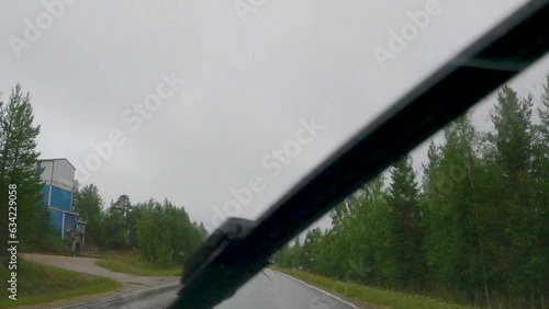 The timelapse video of the car travelliing on the road on a rainy day in Estonia photo