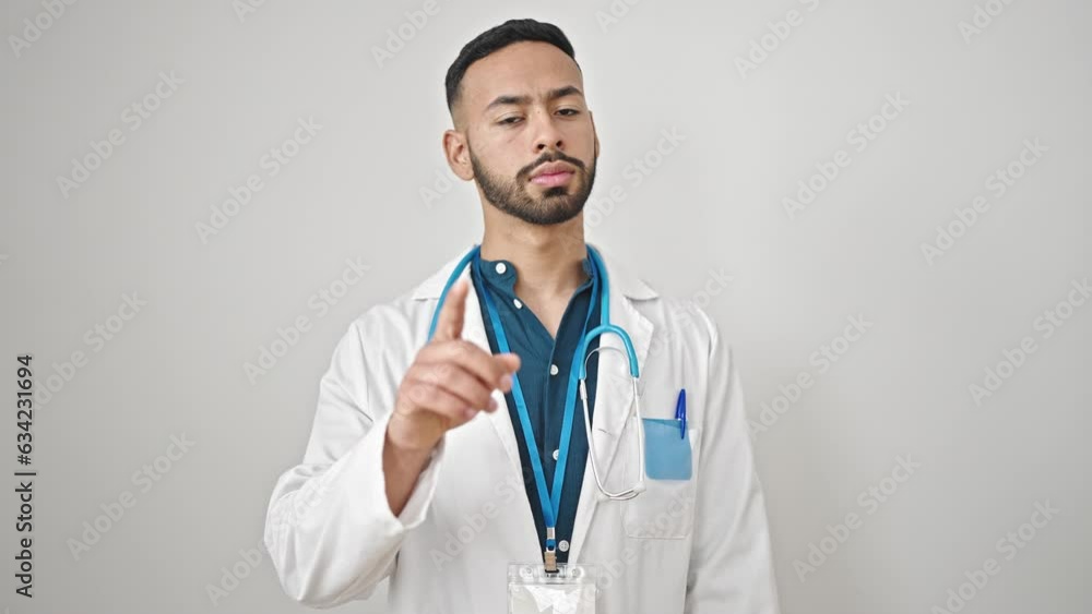 Young hispanic man doctor standing having an argument over isolated white background Young hispanic man doctor standing having an argument over isolated white background