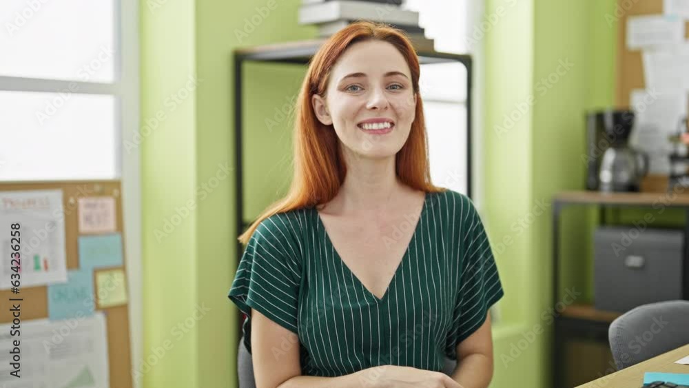 Young redhead woman business worker smiling confident looking watch at office Young redhead woman business worker smiling confident looking watch at office
