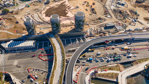 Aerial drone view above the large chimney towers near Rozelle Interchange in Sydney, NSW showing major construction works along City West Link in August 2023 