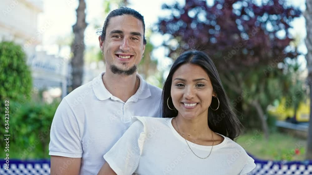 Man and woman couple smiling confident standing together at park Man and woman couple smiling confident standing together at park