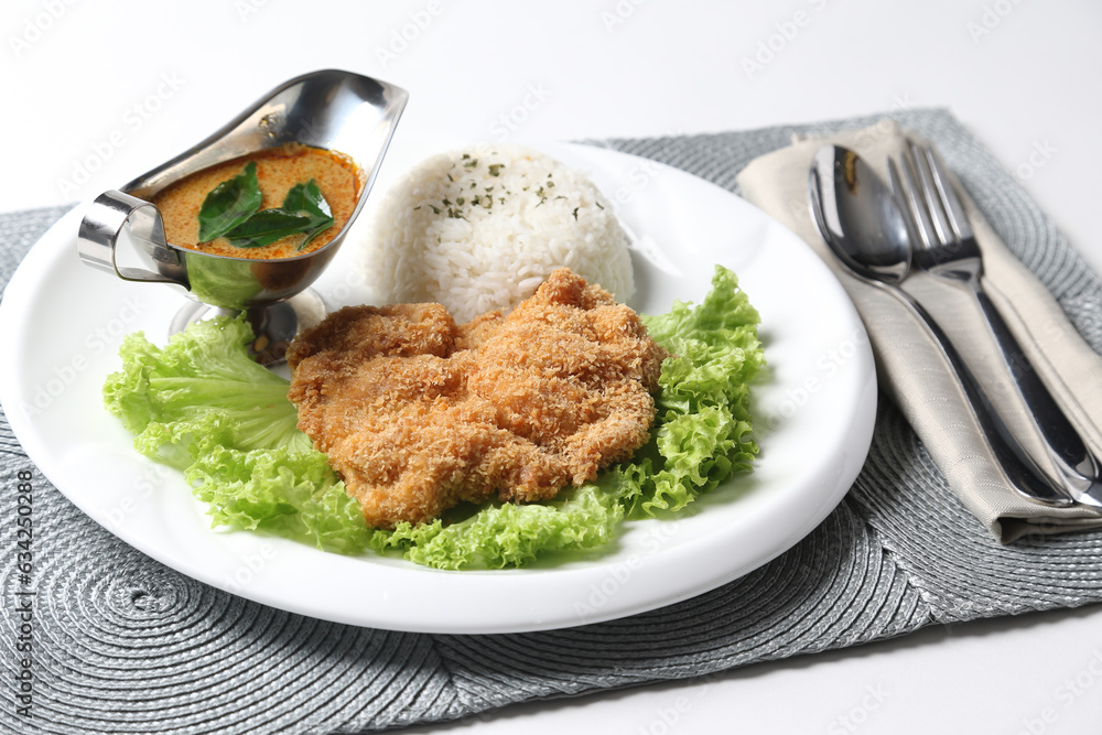 crispy deep fried chicken chop fish cutlet lettuce serve with nonya spicy malay curry leaf sauce and jasmine rice on grey cloth white background design asian chef cuisine halal food menu for cafe crispy deep fried chicken chop fish cutlet lettuce serve with nonya spicy malay curry leaf sauce and jasmine rice on grey cloth white background design asian chef cuisine halal food menu for cafe