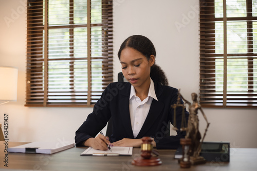 Justice and law concept. Law, legal judgement, courtroom gavel, African American attorney, lawyers discussing contract or business agreement at law firm office, Lawyer woman,