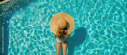 top view back seen close-up photo of a woman in the summer , pool water 