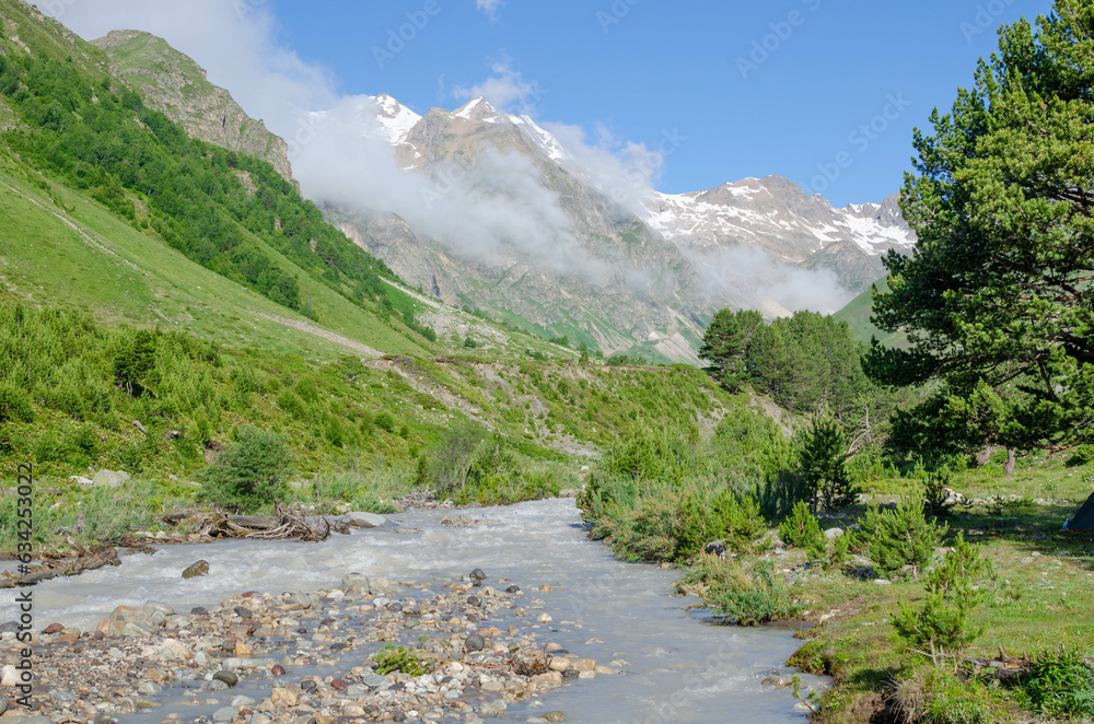 a stormy mountain river.a mountain river flowing down from melting mountain peaks.
