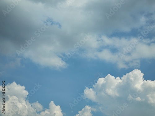 Blue sky with puffy clouds