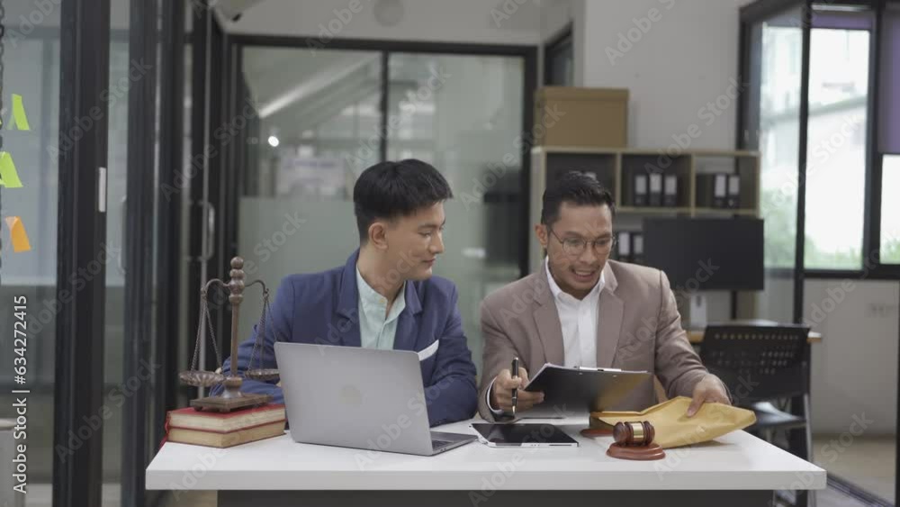 Businessman shaking hands with lawyer to help attorney win court case, concept of law, legal adviser Businessman shaking hands with lawyer to help attorney win court case, concept of law, legal adviser