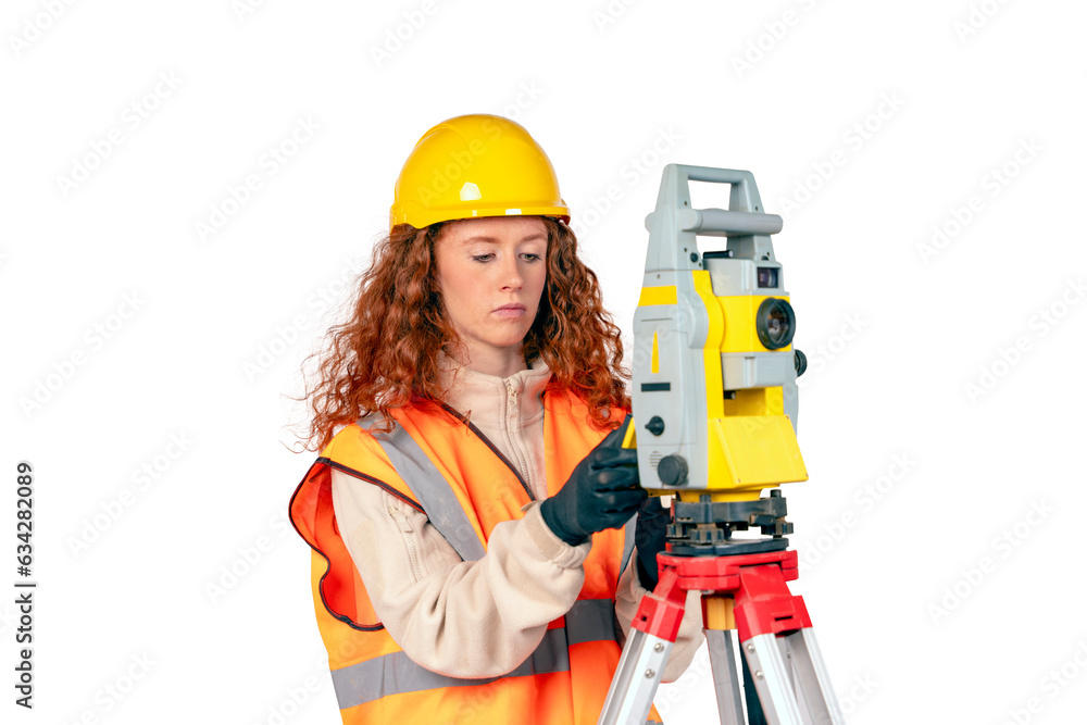 Redhair Woman in yellow hardhat and yellow ppe surveyor working with modern surveying geodesic instrument tacho meter checking coordinates. Young woman working in construction industry concept Redhair Woman in yellow hardhat and yellow ppe surveyor working with modern surveying geodesic instrument tacho meter checking coordinates. Young woman working in construction industry concept