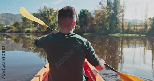 Kayak, river and back view of man on an adventure to explore the water by rowing while camping in nature. Boat, canoe and person in a lake for vacation or holiday in the countryside for freedom photo